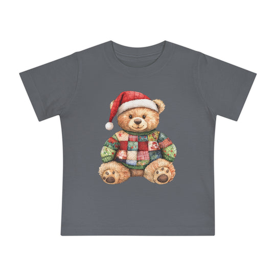 Christmas Bear Baby Tee features a charcoal-gray T-shirt with a teddy bear in a Santa hat and patchwork sweater, ideal for stylish, comfortable first steps.