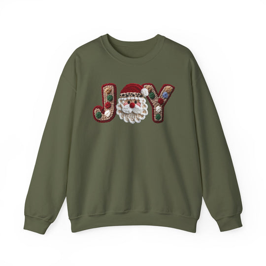Forest-green Joy Crew sweatshirt featuring a gingerbread-themed JOY design with a Santa face. Cozy, durable, classic fit for festive comfort.