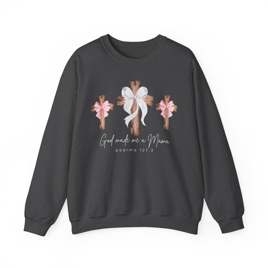 God Made Me a Mama Crew sweatshirt features three wooden crosses with bows and script text, blending comfort and style in a unisex, loose-fit design.
