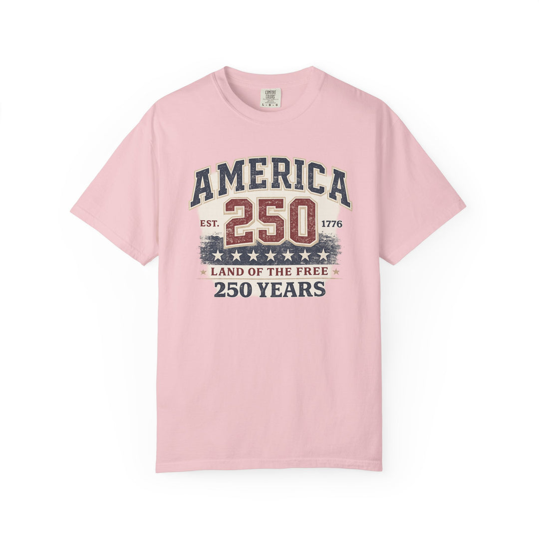 Light pink America 250 Years Tee with vintage graphic celebrating U.S. history, featuring distressed text and numbers, made from soft, durable, 100% ring-spun cotton.