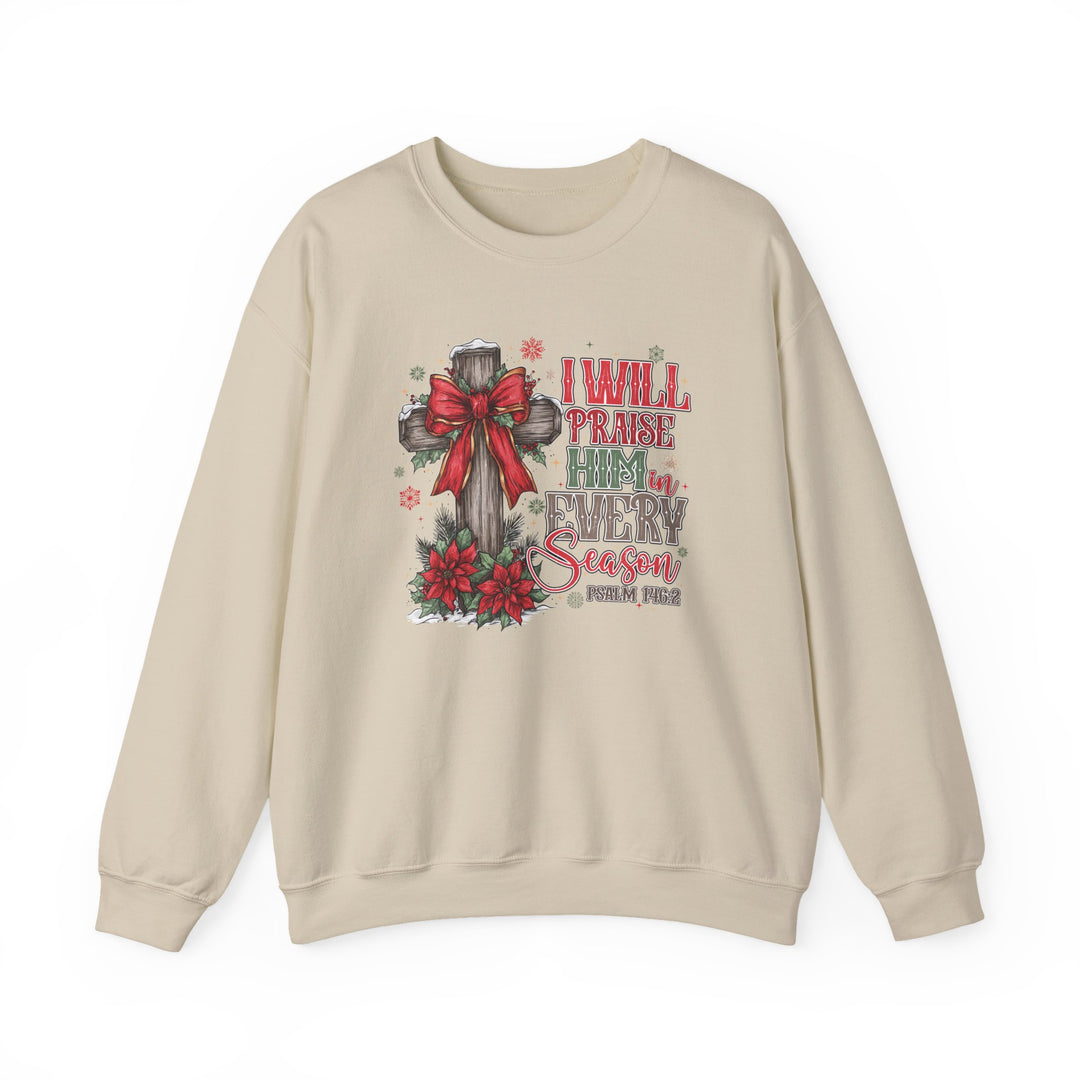 Light-beige crewneck sweatshirt featuring a rustic Christmas-themed Christian graphic with a wooden cross, snow, and Psalm 146:2 text, emphasizing comfort and festive spirit.