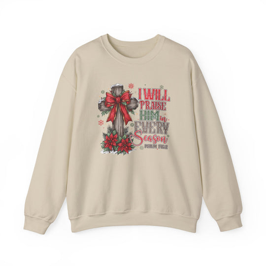 Light-beige crewneck sweatshirt featuring a rustic Christmas-themed Christian graphic with a wooden cross, snow, and Psalm 146:2 text, emphasizing comfort and festive spirit.