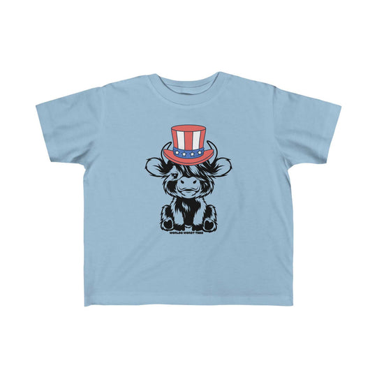 A toddler tee featuring a cartoon cow in a hat, ideal for sensitive skin. Made of 100% combed ringspun cotton, light fabric, classic fit, tear-away label, and true-to-size. Product title: 4th of July Family Cowboy Toddler Tee.
