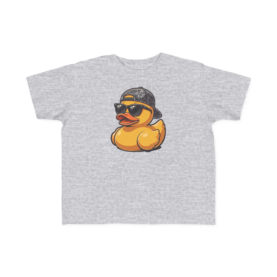 Ducky Toddler Tee features a playful yellow rubber duck wearing sunglasses and a camo cap on a heather-gray T-shirt, perfect for toddlers' sensitive skin.