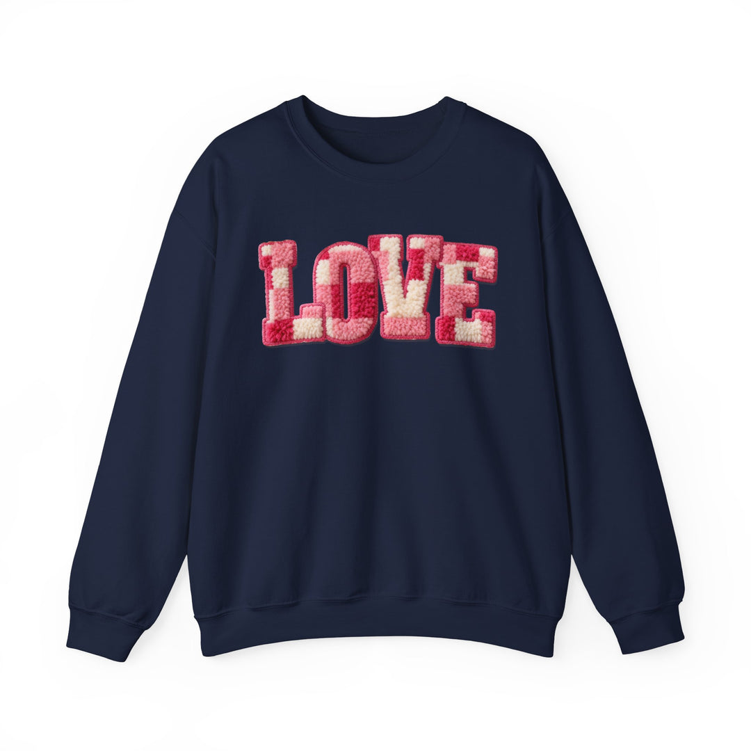 Navy-blue Love Crew sweatshirt with pink and cream sherpa-style LOVE appliqué, long sleeves, ribbed collar, perfect for cozy comfort.