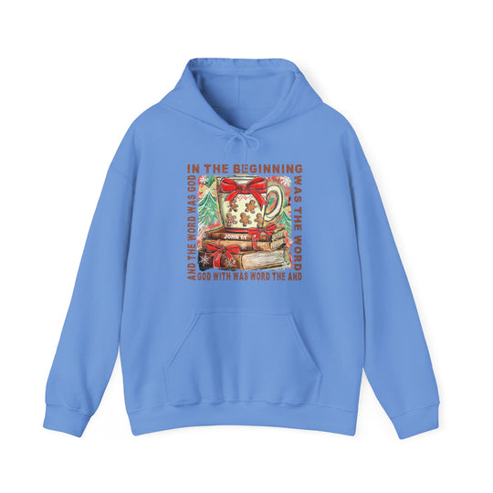 Light-blue In the Beginning Hoodie with Christmas graphic featuring a steaming mug, books, and holiday motifs, celebrating John 1:1 Bible verse.