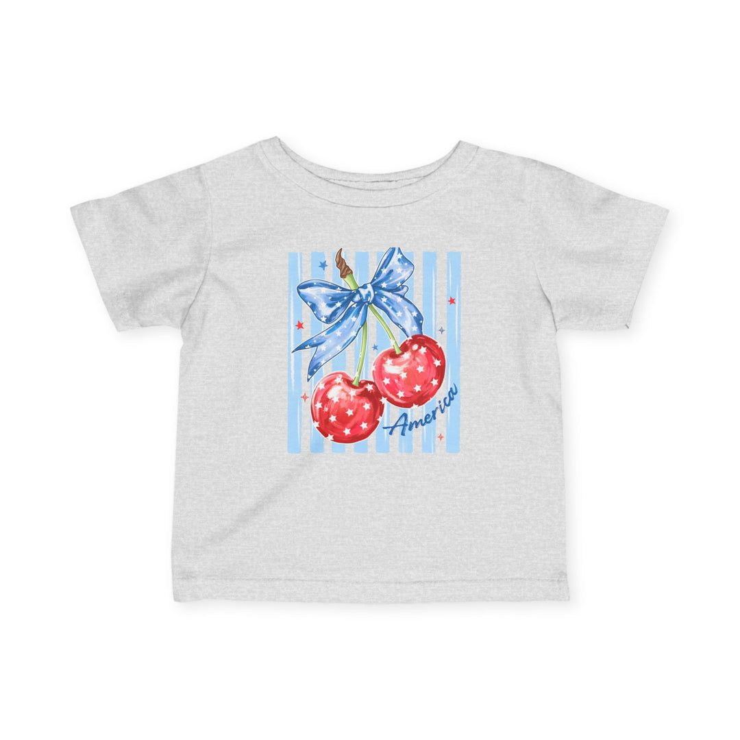 American Cherry Baby Tee: Light gray T-shirt with red cherries and blue ribbon graphic, America scripted below. Made of soft, durable cotton for infants.