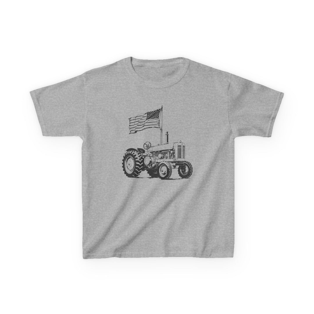 Heather-gray American Boy Kids Tee featuring a black line-drawing of a farm tractor with a waving U.S. flag above it, showcasing patriotic charm for children.