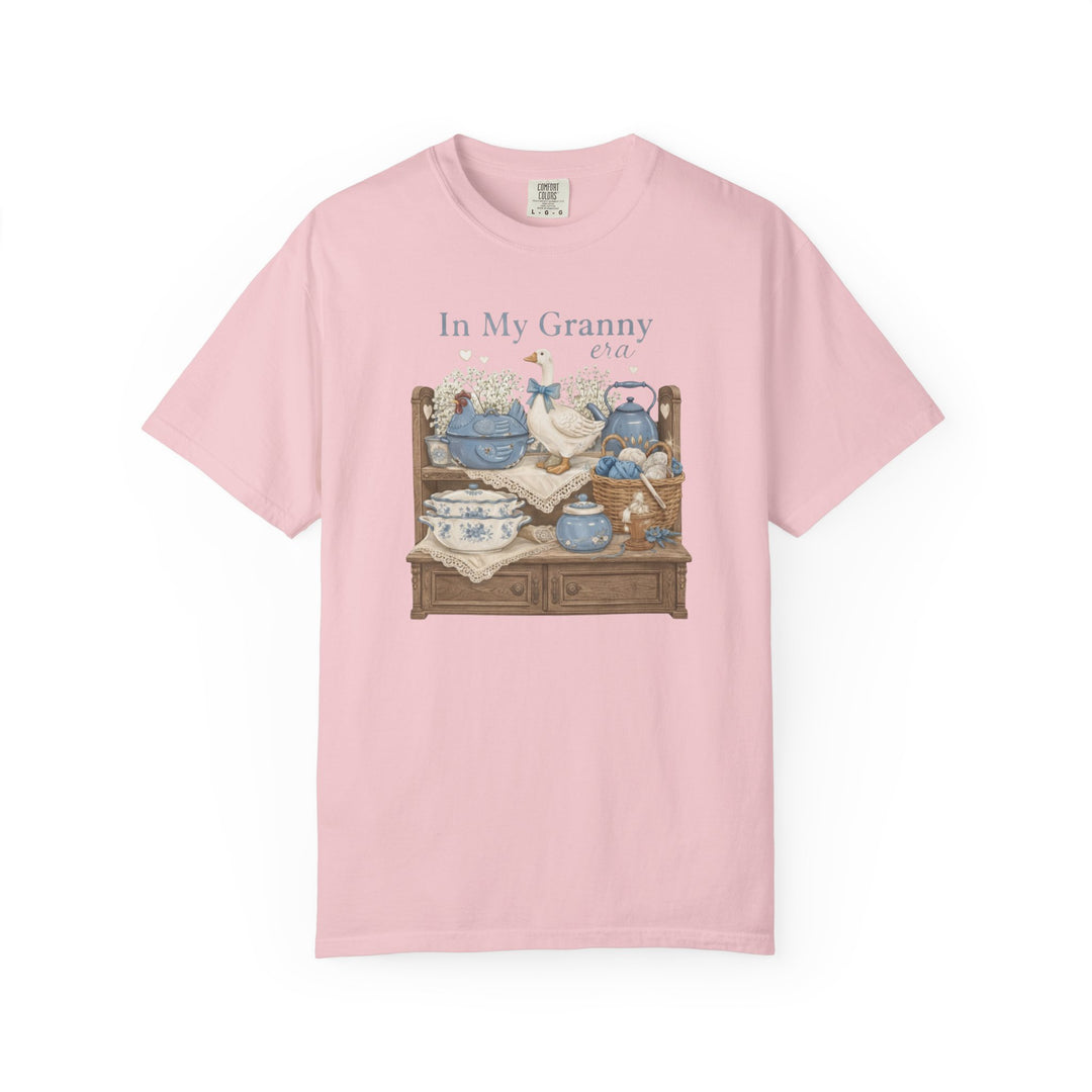 In my Granny Era Tee featuring a nostalgic illustration of vintage kitchen and craft items, reflecting a cozy, grandma-inspired aesthetic.