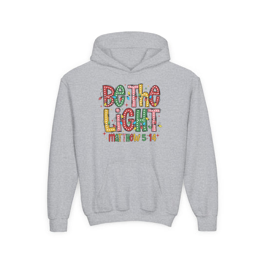 Be the Light Youth Hoodie with festive graphic and 'Matthew 5:14', featuring ultra-soft fleece and kangaroo pocket, ideal for faith-inspired style from Faith Family Designs.