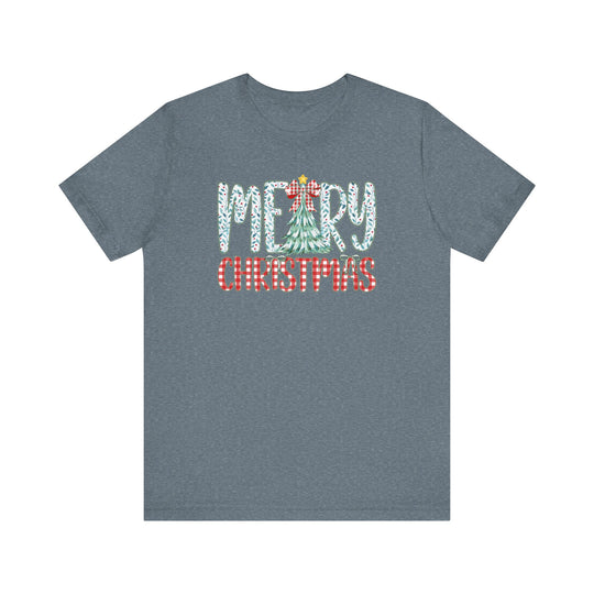 Heather-blue short-sleeve T-shirt featuring MERRY CHRISTMAS with holly-leaf and plaid patterns, highlighting festive spirit. Made from soft cotton for comfort.