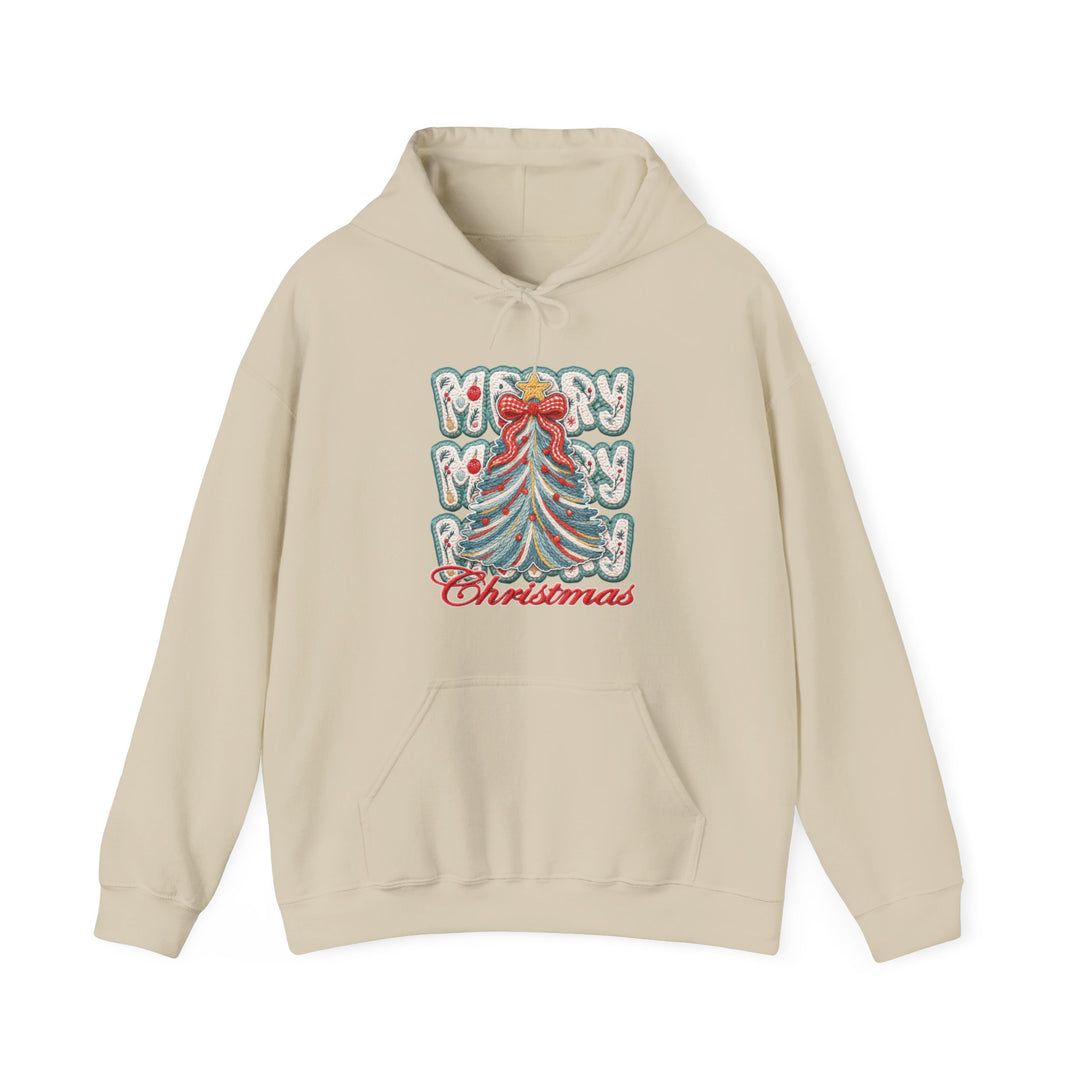 Light-beige pullover hoodie featuring a festive Christmas tree graphic with Merry in snow-covered letters and Christmas in red script, complete with a drawstring hood and pouch pocket.