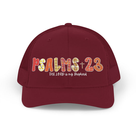 PSALMS 23 Snapback Trucker Cap features colorful embroidery, mesh back, and adjustable fit, offering stylish comfort with its cotton-polyester blend and pre-curved visor.