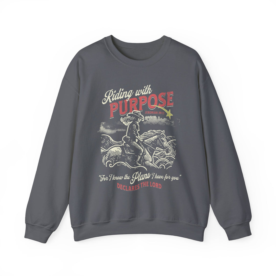 Riding for a Purpose Crew: Grey sweatshirt featuring a graphic of a cowboy on horseback, crafted from a cotton-poly blend for comfort and style.