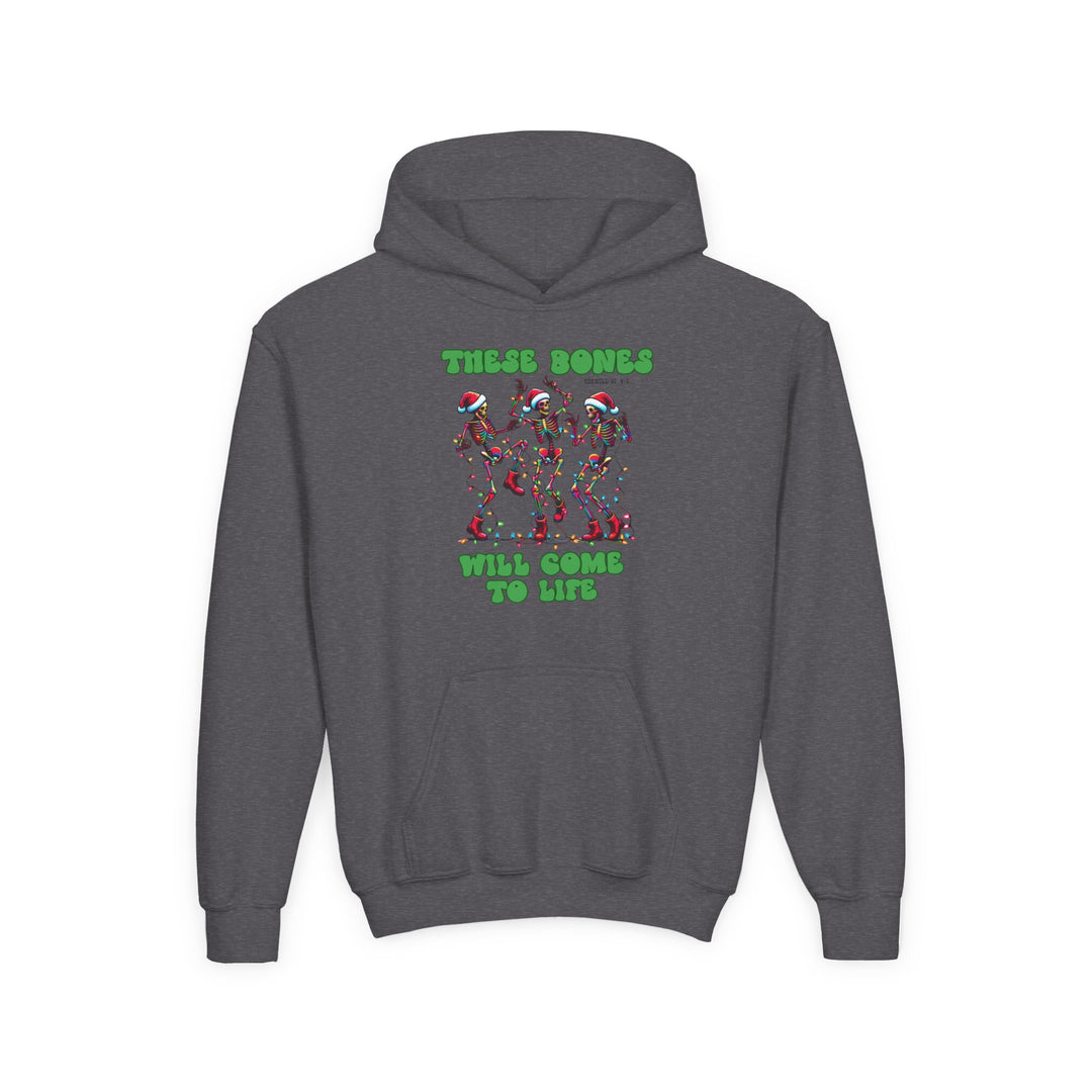 Bones Come to Life Youth Hoodie features dancing skeletons in Santa hats with Christmas lights, bold green lettering, kangaroo pocket, and ribbed cuffs.