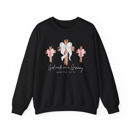 Black crewneck sweatshirt with God Made Me a Grammy text, featuring three wooden crosses with bows, ideal for comfort and style.