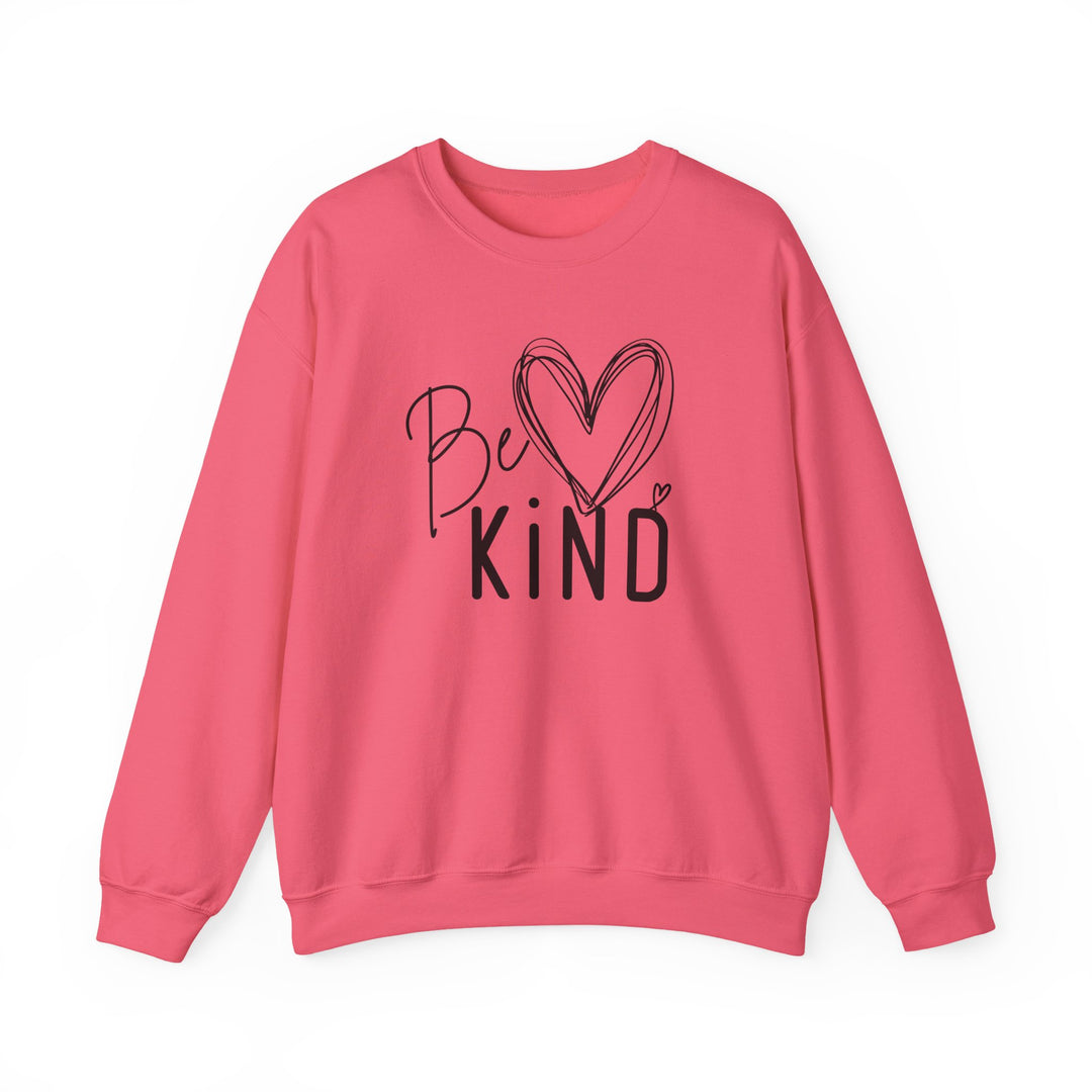 Pink crew-neck sweatshirt with “Be ♥ KiND” design in black, ideal for comfort and durability, crafted from a cotton-polyester blend by Faith Family Designs.