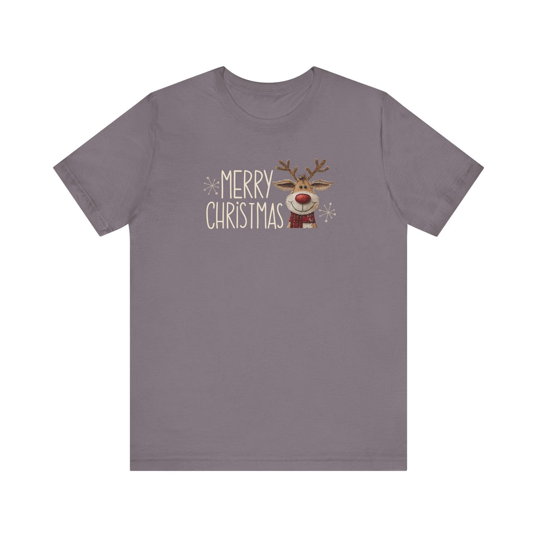 Merry Christmas Reindeer Tee featuring playful hand-lettered text, snowflake accents, and a cartoon reindeer with a red nose and scarf on a gray-purple background.