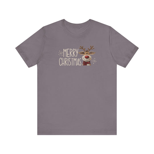 Merry Christmas Reindeer Tee featuring playful hand-lettered text, snowflake accents, and a cartoon reindeer with a red nose and scarf on a gray-purple background.