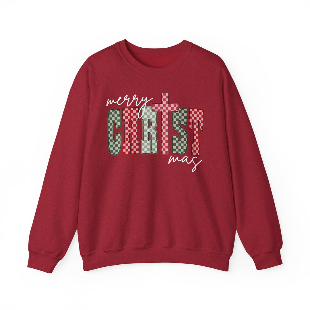 Red crew-neck sweatshirt featuring a festive Merry Christmas graphic in playful, patchwork style, combining script and block letters with a cozy, classic fit.