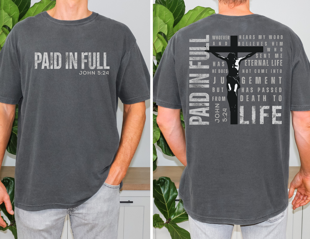 Front and back views of the Paid in Full Tee, featuring a Christian message and verse, worn by a casually dressed model.