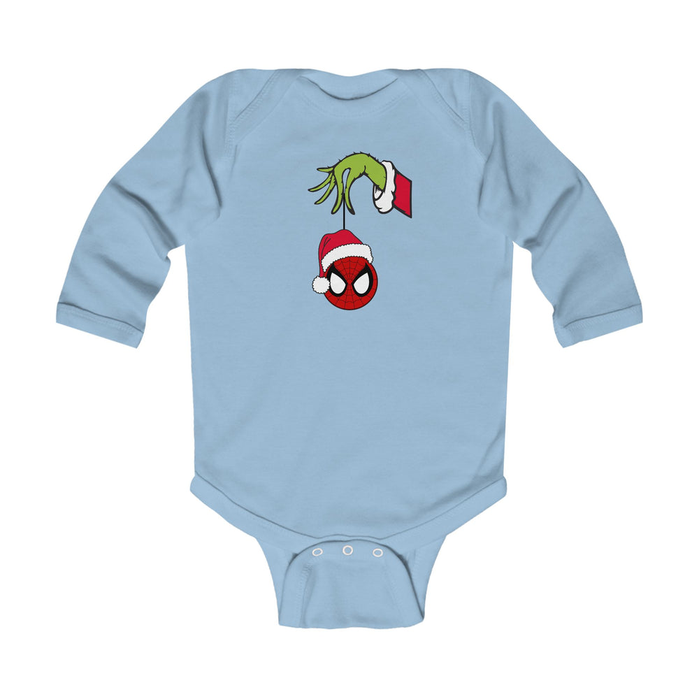 Spider Ball Christmas Onesie: Light-blue baby bodysuit featuring a Grinch-like hand holding a Spider-Man ornament with a Santa hat, crafted for comfort and durability.