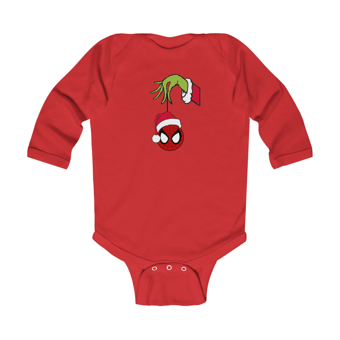 Spider Ball Christmas Onesie: Red baby bodysuit with Grinch hand holding a Spider-Man ornament, featuring Santa hat. Soft, durable cotton with easy-change snaps.