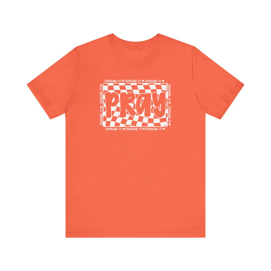 Pray Tee: Red t-shirt featuring bold white text, crafted from soft cotton for a comfortable fit, with ribbed knit collars and dual side seams. Unisex design.