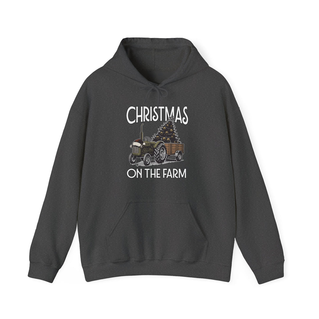 Christmas at the Farm Hoodie featuring a festive tractor and Christmas tree graphic, ideal for warmth and style in cold weather.