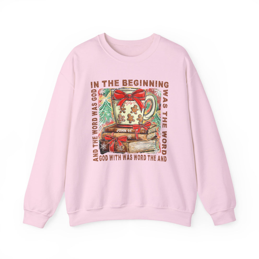 Light-pink In the Beginning Crew sweatshirt with a Christmas-themed Christian graphic, featuring a steaming mug, gingerbread cookies, and John 1:1 scripture text.