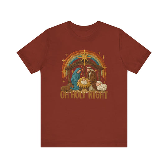 Oh Holy Night Tee with embroidered Nativity scene featuring Mary, Joseph, baby Jesus, animals, and star. Crafted from soft cotton, it offers comfort and durability.