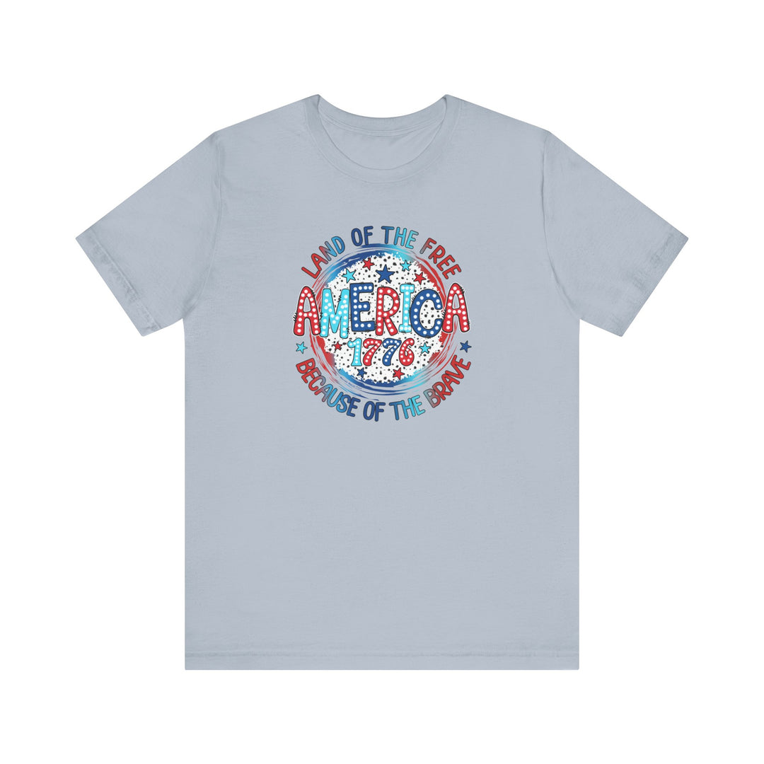 A classic unisex jersey tee featuring a patriotic America 1776 logo. Made of 100% cotton, with ribbed knit collars and taping on shoulders for durability. Retail fit, tear away label, true to size.