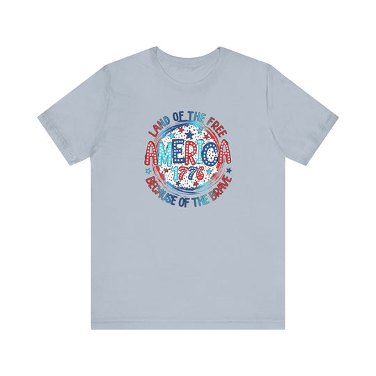A classic unisex jersey tee featuring a patriotic America 1776 logo. Made of 100% cotton, with ribbed knit collars and taping on shoulders for durability. Retail fit, tear away label, true to size.
