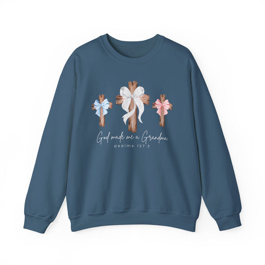 Blue crewneck sweatshirt featuring three wooden crosses with bows and the phrase “God made me a Grandma” with Psalms 127:3, offering comfort and style.
