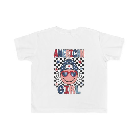American Girl Toddler Tee featuring a cartoon face with sunglasses and a hat, perfect for sensitive skin. 100% combed ringspun cotton, light fabric, tear-away label, classic fit. Available in sizes 2T to 5-6T.
