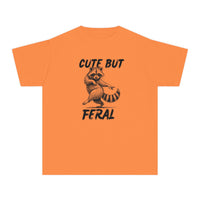 Cute but Feral Kids Tee featuring a stylized raccoon illustration with bold lettering, designed for comfort and agility in a classic fit for active kids.
