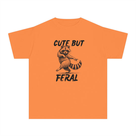 Cute but Feral Kids Tee featuring a stylized raccoon illustration with bold lettering, designed for comfort and agility in a classic fit for active kids.