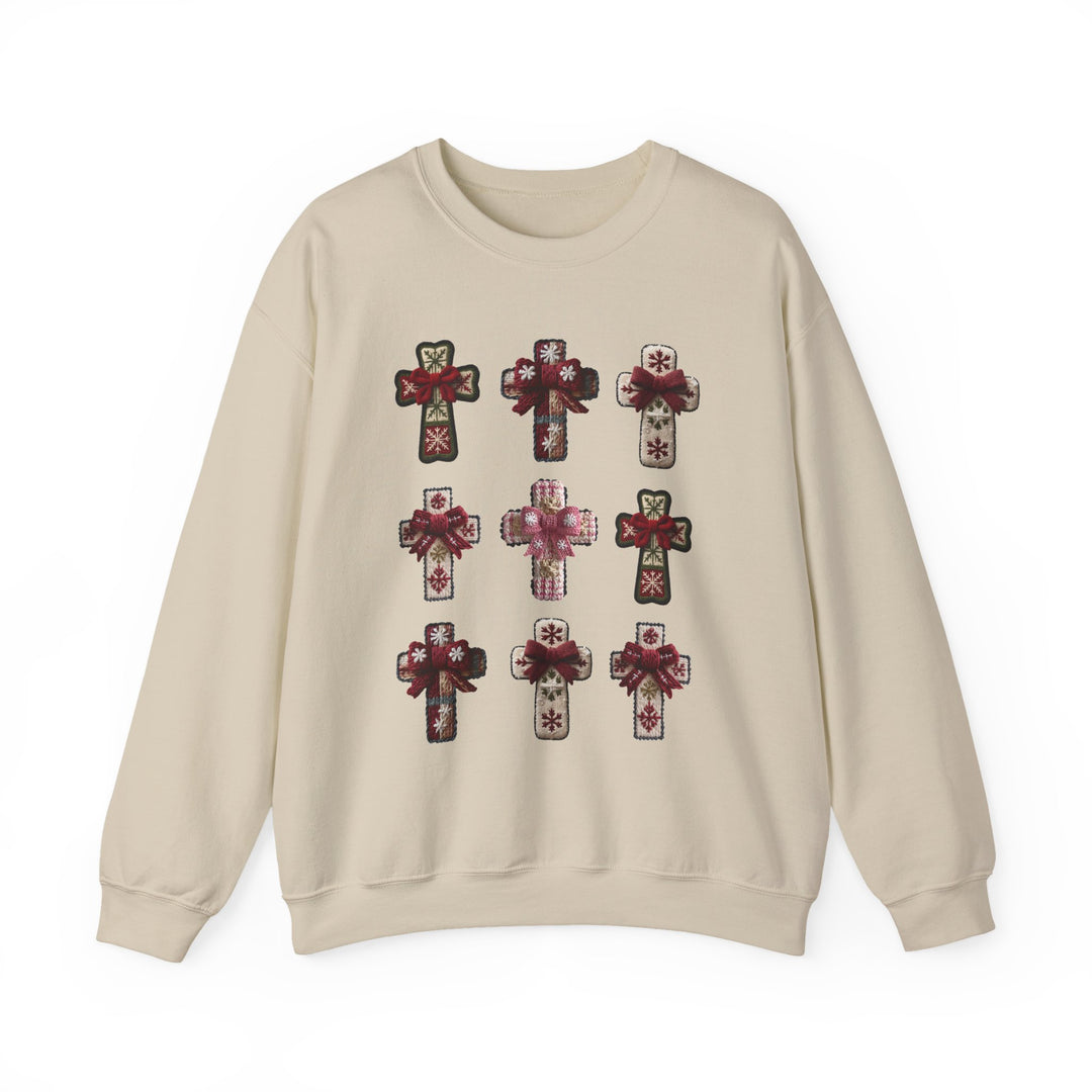 Light-beige crewneck sweatshirt titled Crosses Crew, featuring a 3x3 grid of stylized crosses with snowflake patterns and red ribbon bows, offering cozy comfort.