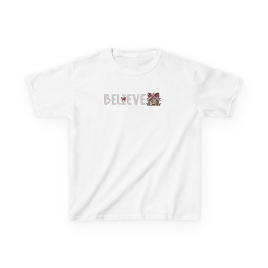 Believe Kids Tee featuring BELIEVE in festive font with nativity-stable illustration, crafted from durable, ethically sourced cotton, perfect for everyday wear.