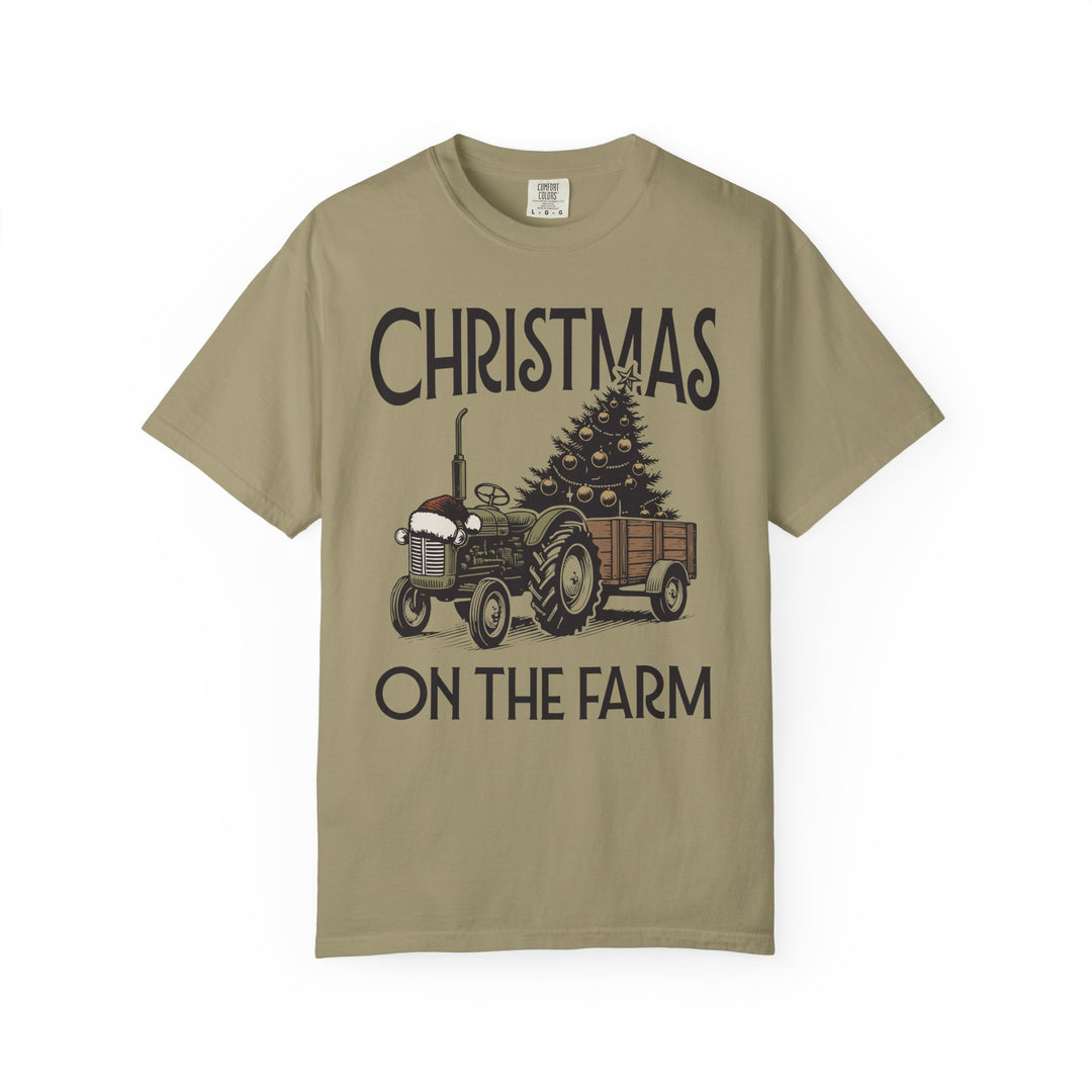 Christmas on the Farm Tee with vintage tractor and decorated tree, festive design on khaki Comfort Colors T-shirt, capturing holiday spirit.