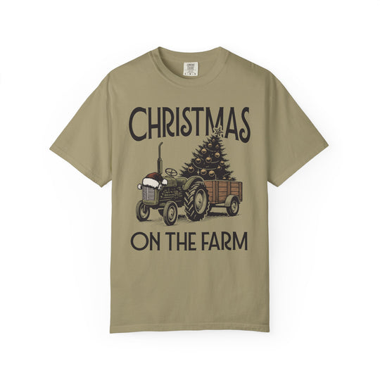Christmas on the Farm Tee with vintage tractor and decorated tree, festive design on khaki Comfort Colors T-shirt, capturing holiday spirit.