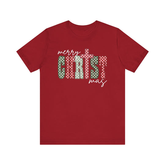 Red Christmas Tee with festive “Merry Christmas” graphic, featuring cursive and checkerboard lettering. Soft cotton, unisex fit with ribbed collar and taped shoulders for lasting shape.