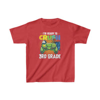 A red kids tee featuring a game controller design, ideal for everyday wear. Made of 100% cotton, light fabric, with twill tape shoulders for durability. Perfect for 3rd graders.