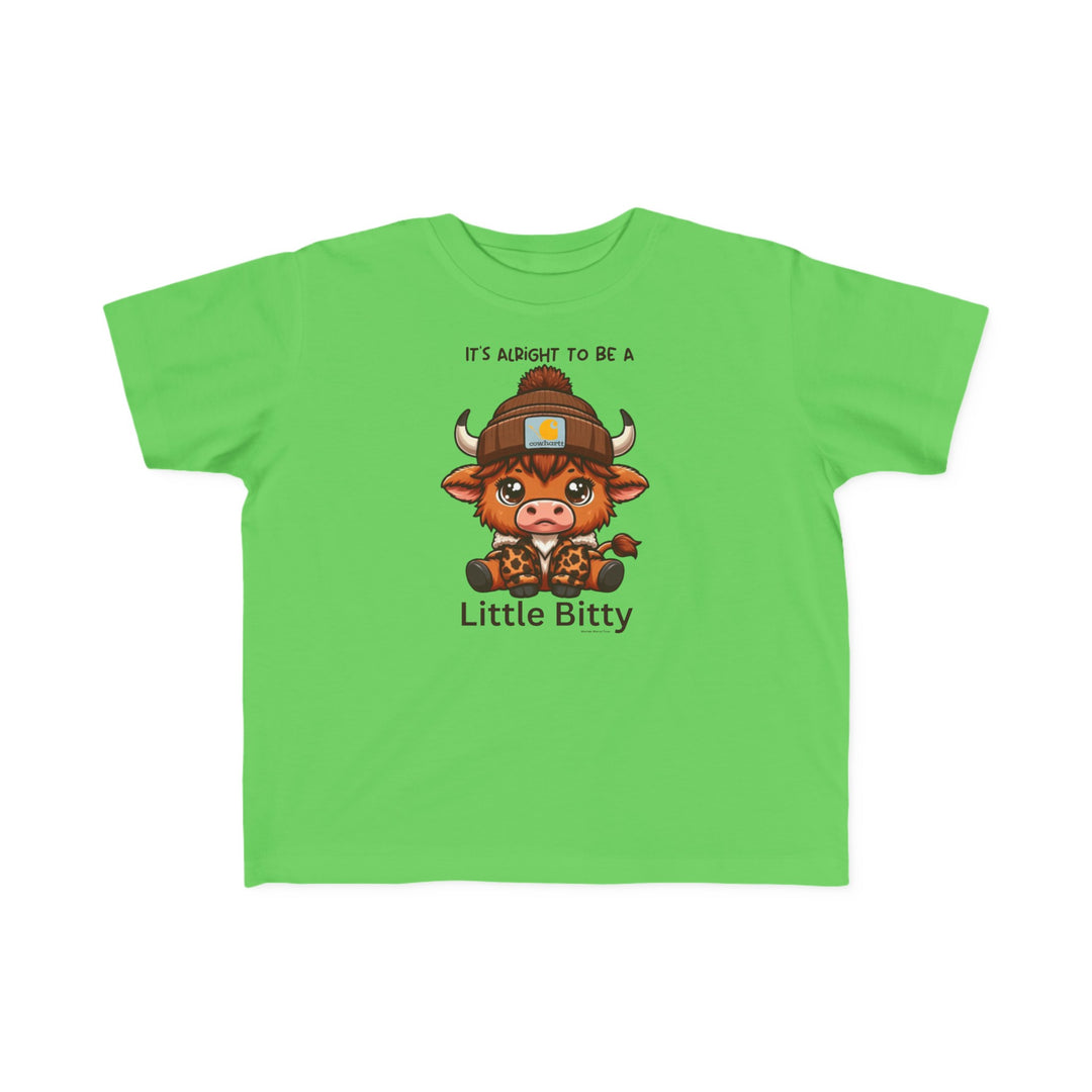 A Little Bitty Toddler Tee featuring a cartoon cow print on a green shirt. Made of soft 100% combed ringspun cotton, light fabric, tear-away label, and a classic fit. Sizes available: 2T, 3T, 4T, 5-6T.