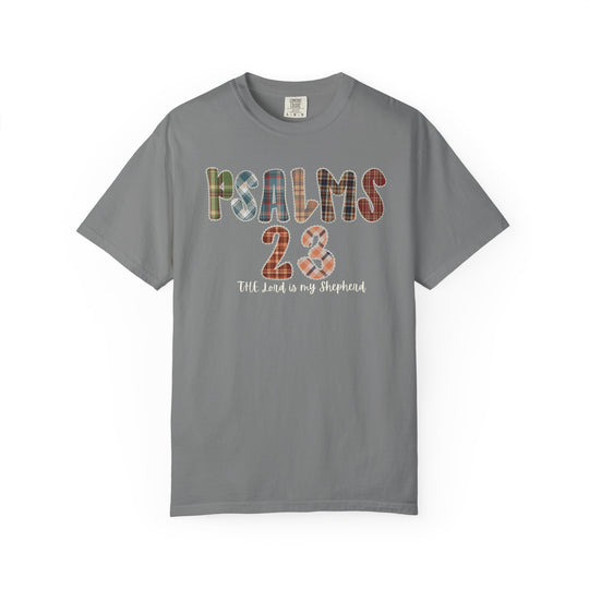 Psalms 23 Tee: A gray T-shirt with PSALMS 23 in plaid letters and The Lord is my Shepherd script, offering a stylish faith-inspired design.
