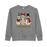 Christmas Geese Toddler Crew sweatshirt featuring three festive cartoon geese in holiday attire, perfect for keeping toddlers warm and stylish.