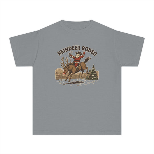 Reindeer Rodeo Kids Tee featuring Santa as a cowboy on a reindeer, ideal for active kids, crafted from soft-washed, 100% combed ring-spun cotton.