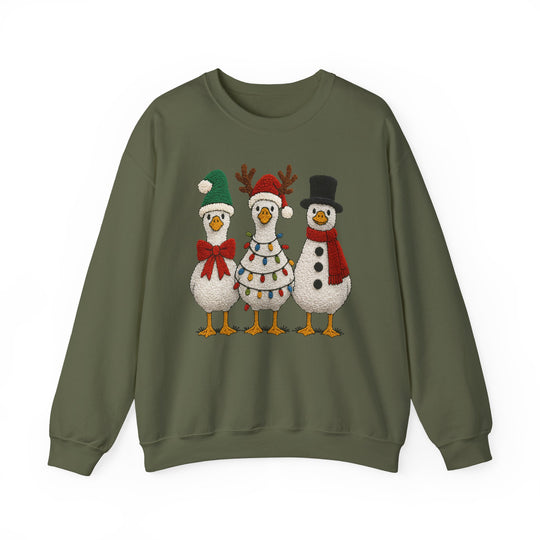 Olive-green crewneck sweatshirt with whimsical holiday geese graphic: Santa goose, reindeer goose with lights, and snowman goose. Cozy, unisex fit, ideal for colder months.