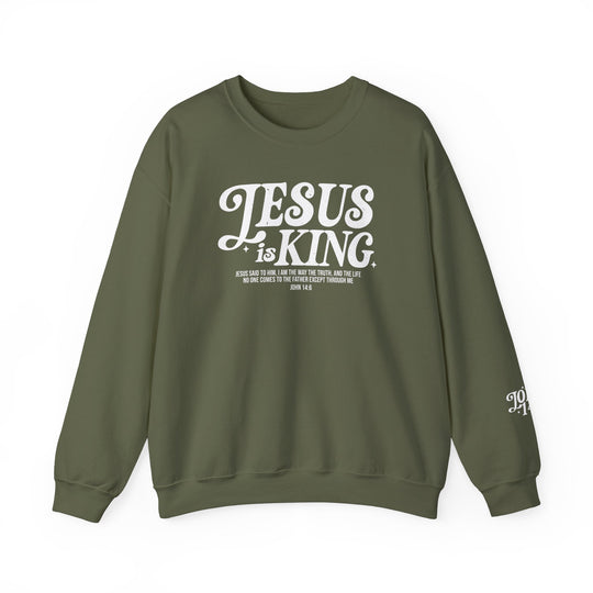 Green sweatshirt with Jesus is King Crew in white text, featuring a comfortable, loose fit with ribbed knit collar. Made from a polyester-cotton blend.