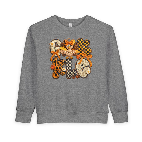 Gobble Toddler Crew heather-gray sweatshirt with crochet GOBBLE design and turkey motif, offering warmth and style for toddlers.